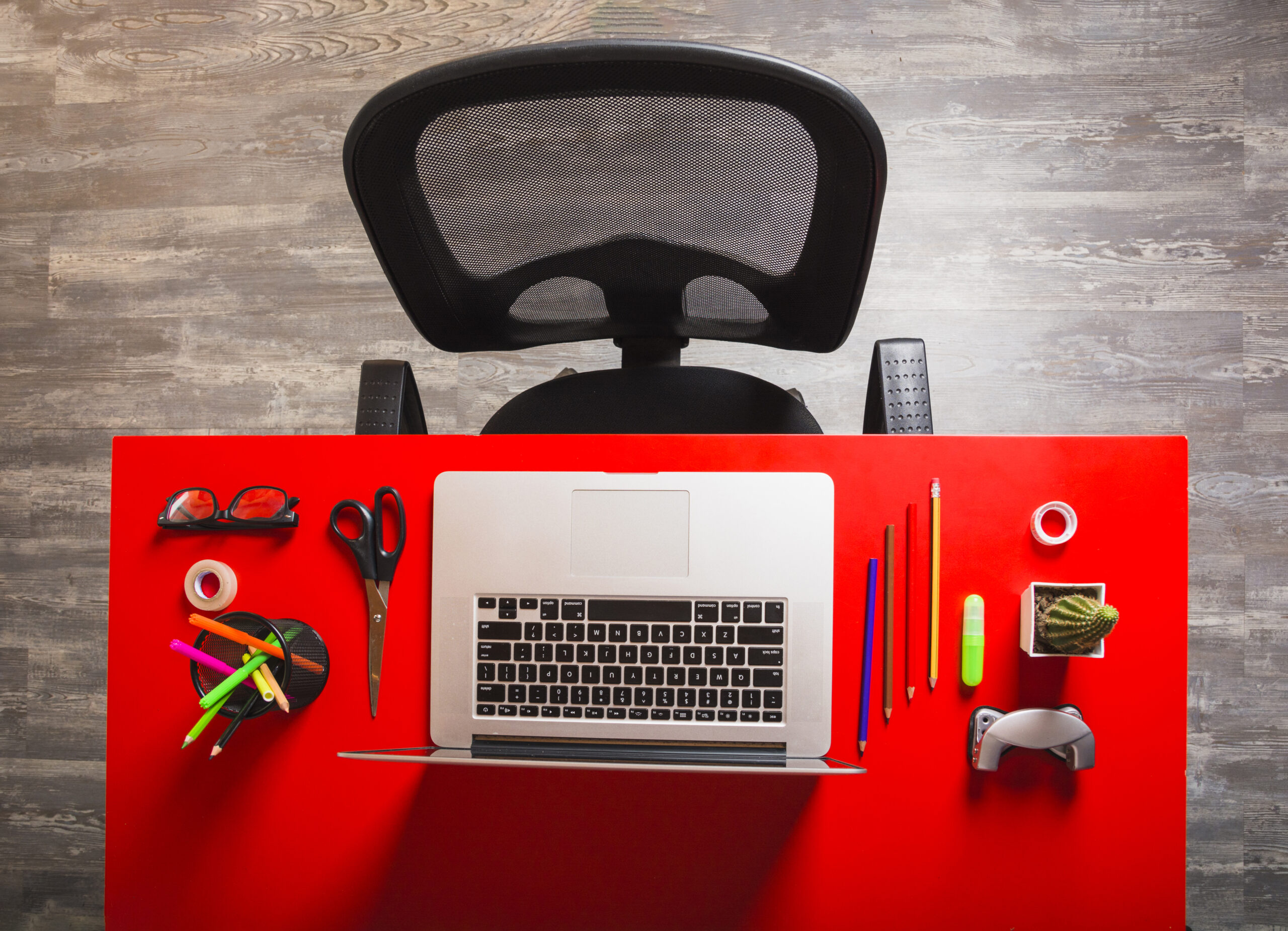 office-workplace-with-laptop-stationeries-red-wooden-red-table